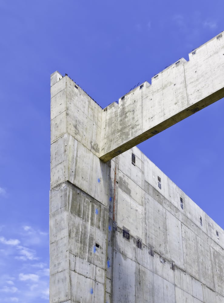 Corner of large building, with buttress, under construction
